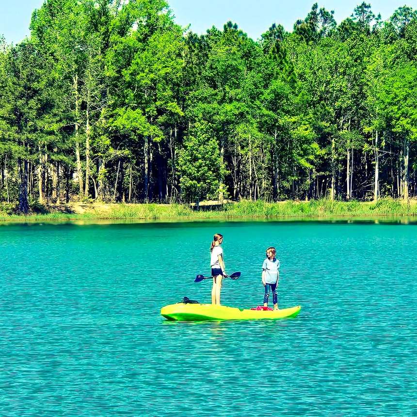 Kids paddling on the calm lake at Lake LaCroix