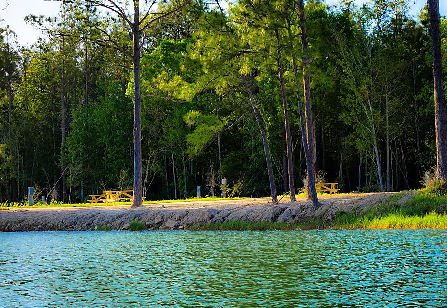 Lakeside full-hookup RV sites with concrete pads at Lake LaCroix RV Resort in Bay St. Louis